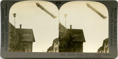 Zeppelin Flying Over the Roofs of a Town by Keystone View Company